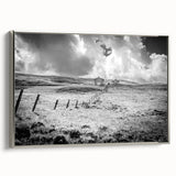 Framed canvas wall art showcasing a serene countryside landscape design with vibrant greens and blues, elegantly bordered in silver. Ideal for home decor and art lovers.
