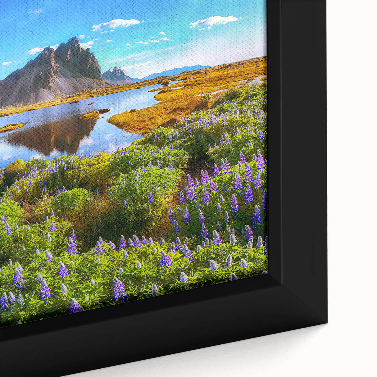 Framed canvas wall art featuring a serene countryside landscape with vibrant green fields and a clear blue sky, perfect for enhancing home decor.