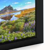 Framed canvas wall art featuring a serene countryside landscape with vibrant green fields and a clear blue sky, perfect for enhancing home decor.