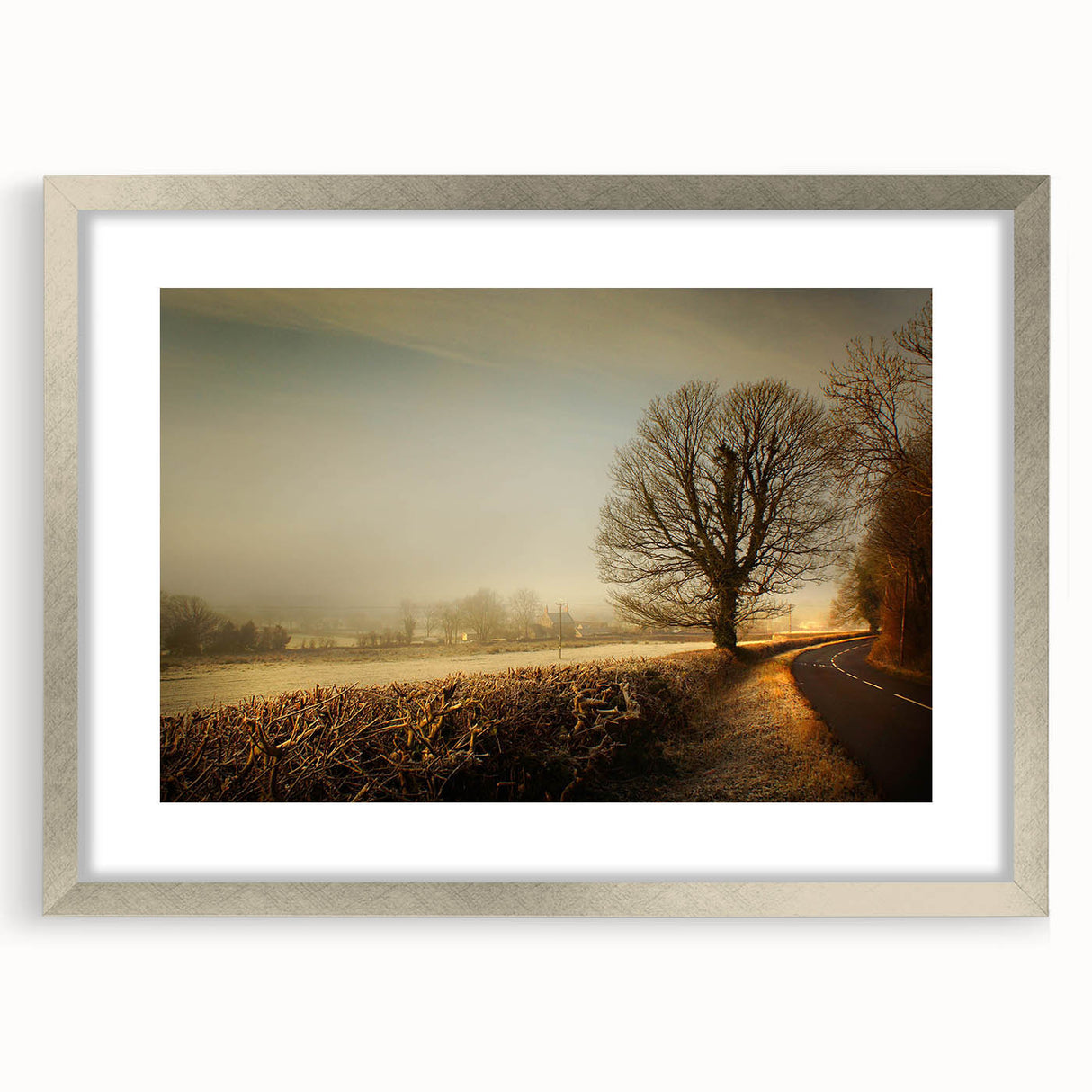 Framed wall art collection showcasing serene countryside landscapes with a silver mat, enhancing home decor with nature-inspired elegance and tranquility.