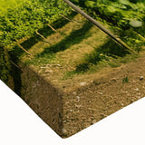 Close-up of a stretched canvas wall art piece showcasing a vibrant countryside landscape with lush greenery and rolling hills, perfect for home decor.