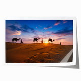 Desert landscape wall art print showcasing vibrant orange and yellow hues, featuring rolling sand dunes and a dramatic sunset, rolled for easy shipment.