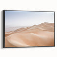 Framed canvas wall art showcasing a serene desert landscape with warm earth tones, displayed in a sleek black frame from the Desert Design collection.
