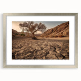 Framed silver wall art featuring a stunning desert landscape design, complete with a mat for an elegant presentation, ideal for home decor or office settings.