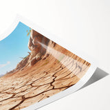 Vibrant desert landscape wall art print showcasing warm tones of orange and yellow, rolled for easy shipping in a protective tube, perfect for home decor.