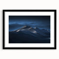 Framed black wall art showcasing a serene desert landscape with rolling dunes, complemented by a white mat, perfect for modern home decor and aesthetic enhancement.