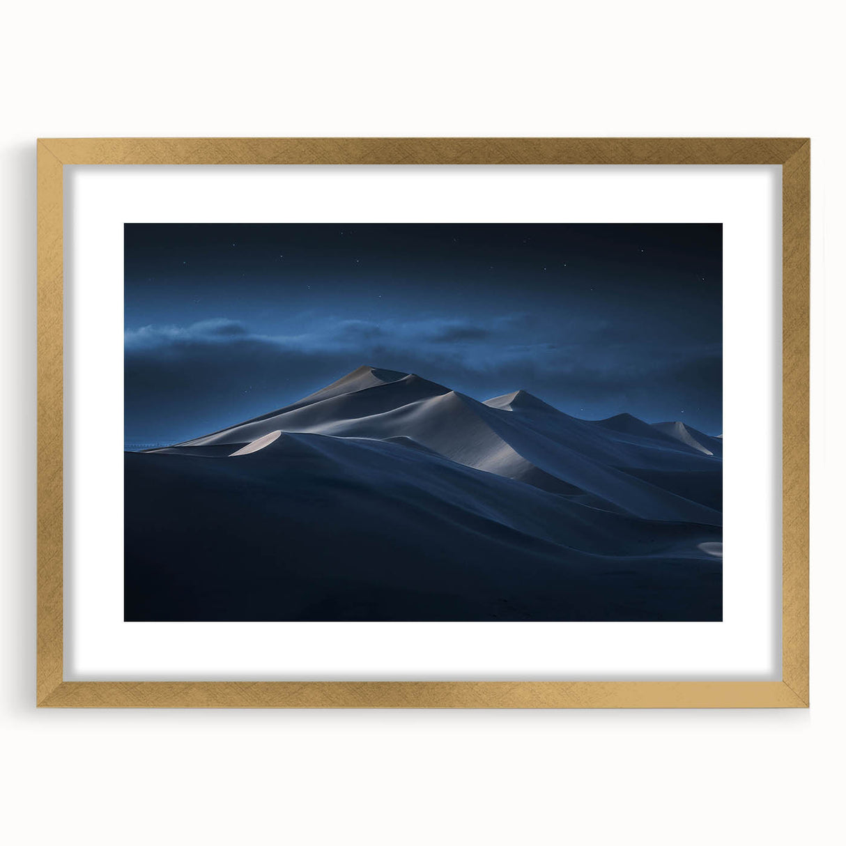 Framed wall art featuring a serene landscape of sand dunes, elegantly presented with a gold mat. This high-quality print enhances any modern decor with its calming colors and intricate details, perfect for living spaces or offices.