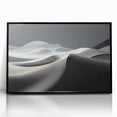 Framed wall art showcasing a stunning desert dunes landscape in warm beige and brown tones, presented in a sleek black frame, perfect for modern home decor.