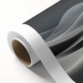Rolled canvas showcasing a serene desert landscape with golden dunes and a sunset sky, ideal for modern home decor. Packaged securely in a cardboard tube for safe shipping.