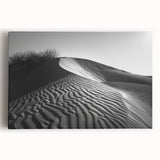 Stretched canvas wall art depicting a serene desert landscape with rolling sand dunes, warm golden tones, and a tranquil sky, ideal for modern home decor.