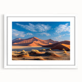 Framed landscape wall art showcasing serene sand dunes in warm beige and golden hues, accented by a white mat, perfect for enhancing modern home decor.