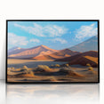 Framed wall art featuring a serene landscape of sand dunes, designed with a sleek black frame, ideal for modern home decor, adding elegance to any room.