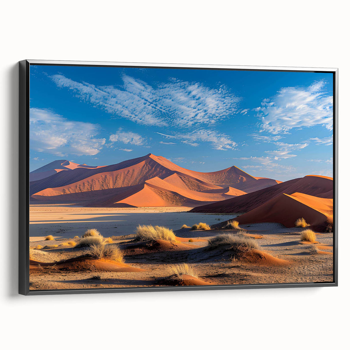 Framed canvas wall art featuring an abstract landscape of dunes in soft beige and brown tones, displayed from a black side view, perfect for modern decor.