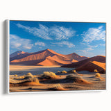 Framed canvas wall art showcasing a serene desert dune landscape in warm tones, elegantly displayed from a side view on a white background, ideal for modern decor.