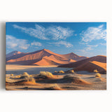 Stretched canvas wall art displaying a serene desert landscape with golden sand dunes and a vibrant blue sky, perfect for adding elegance to home decor.