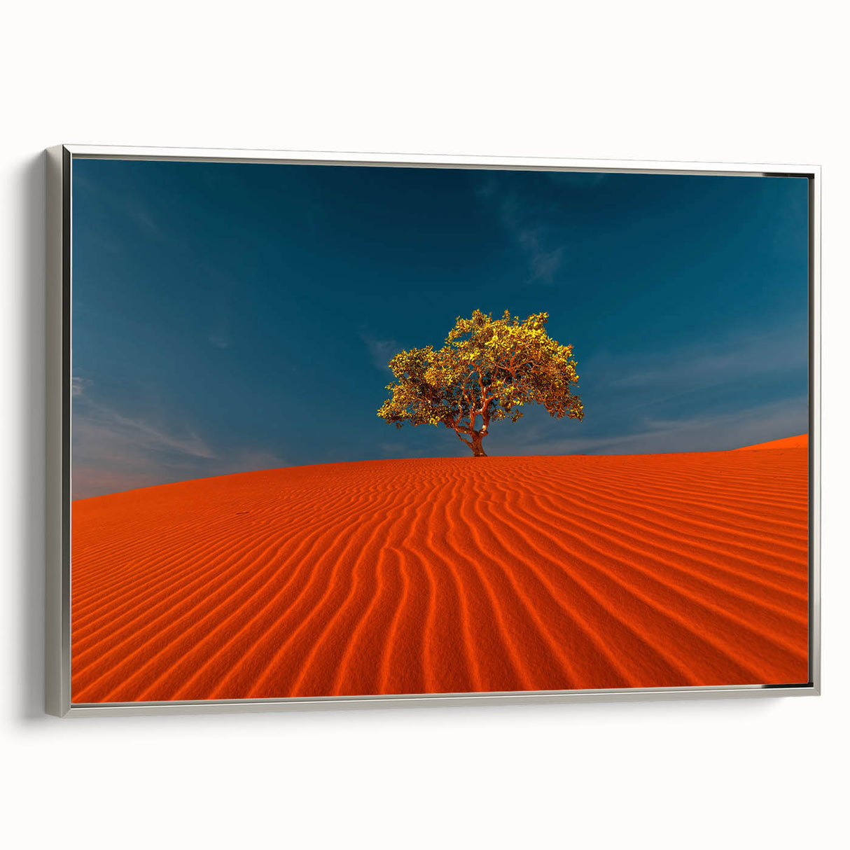 Framed canvas wall art showcasing a serene desert landscape with soft dunes and a silver frame, ideal for modern home decor and enhancing interior aesthetics.