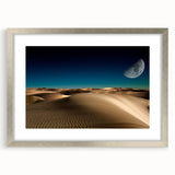 Framed wall art featuring a serene landscape of sand dunes in soft beige and golden hues, elegantly matted and presented in a sleek silver frame, perfect for home decor.