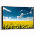 Framed canvas wall art showcasing a serene landscape with vibrant green fields and a clear blue sky. The artwork features a sleek black frame, enhancing its aesthetic appeal for modern home decor. Ideal for adding a touch of nature to living spaces.