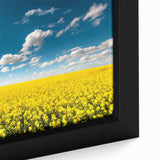 Framed close-up view of a vibrant landscape wall art piece, showcasing lush green fields and a serene blue sky, perfect for home decor enhancement.