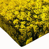 Close-up view of a stretched canvas wall art piece showcasing vibrant landscape fields, featuring rich greens and blues, ideal for home decor enhancement.