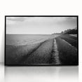 Framed acrylic wall art featuring a serene landscape of lush green fields under a clear blue sky, showcasing vibrant colors and depth with a sleek black frame. Perfect for modern home decor.