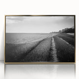 Framed wall art showcasing a vibrant landscape of golden fields under a blue sky, perfect for modern home decor. Ideal for elevating any living space.