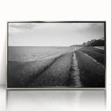 Framed acrylic wall art featuring a serene landscape of golden fields under a bright blue sky, designed to enhance modern home decor with elegance and tranquility.