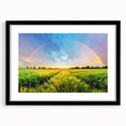 Framed wall art featuring a serene landscape with lush green fields and a soft blue sky, presented in a sleek black frame with a mat, perfect for home decor.