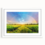 Framed wall art featuring a serene landscape design with soft green fields and blue skies, elegantly showcased in a white mat. Ideal for home decor.