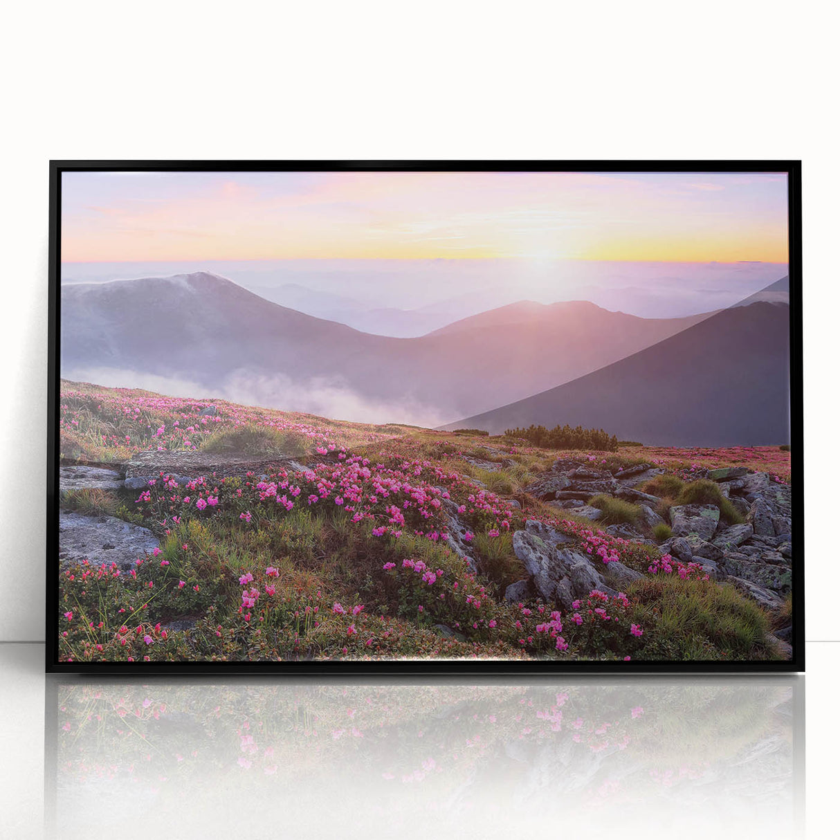 Framed wall art featuring a vibrant landscape design with lush green fields and a blue sky, presented in a sleek black frame, ideal for modern home decor.