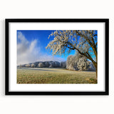 Framed wall art collection showcasing a serene landscape of fields, featuring a black mat and sleek frame, perfect for enhancing home decor with a natural theme.