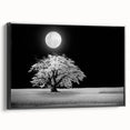 Framed canvas wall art showcasing a serene landscape of rolling fields in soft green and golden hues. The black frame adds a modern touch, enhancing the artwork's elegance. Ideal for home decor.