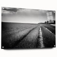 Acrylic glass wall art collection showcasing vibrant landscapes and fields, displayed from a side view with decorative pins, ideal for modern home decor.