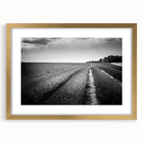 Framed wall art collection showcasing serene landscapes and fields in soft earth tones, featuring a gold mat and ornate frame, perfect for home decor enhancement.