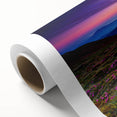 Vibrant rolled canvas showcasing a serene landscape with lush green fields and a clear blue sky, perfect for adding a touch of nature-inspired decor to any space.