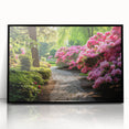 Framed acrylic wall art featuring a vibrant landscape design with lush greenery and colorful flowers, displayed in a sleek black frame, perfect for home decor.