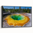 Framed wall art showcasing a geyser landscape design in a black frame, highlighting vibrant colors and intricate details, perfect for modern home decor.