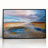 Framed acrylic wall art featuring a vibrant geyser landscape design in a sleek black frame, perfect for modern home decor, showcasing rich colors and dynamic elements.