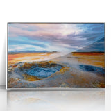 Framed acrylic wall art showcasing a colorful geyser landscape design, featuring vibrant blues and greens, perfect for modern home decor.