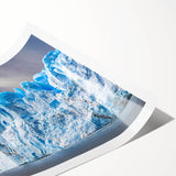 Vibrant wall art print showcasing a stunning glacier landscape in cool blue and white tones, ideal for home decor. Rolled and ready for easy framing or display.