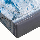 Close-up of a stretched canvas featuring a vibrant glacier landscape design, showcasing intricate ice formations and rich blue hues, perfect for modern home decor.