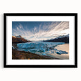 Framed wall art featuring a stunning glacier landscape design, with a black mat and sleek frame, perfect for modern home decor. Emphasizes natural beauty and tranquility.