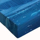 Close-up of a stretched canvas print showcasing a vibrant glacier landscape design, featuring rich blues and whites, ideal for modern home decor.