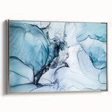 Framed canvas wall art depicting a stunning glacier landscape, featuring cool blue and white hues, displayed with a sleek silver frame, ideal for modern decor.