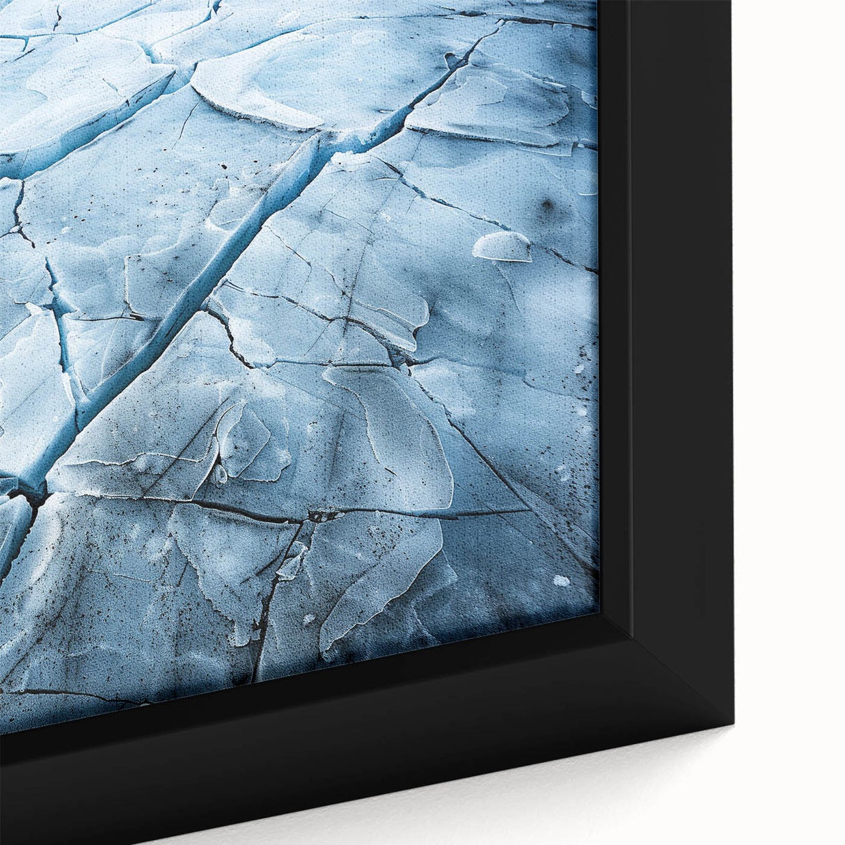 Close-up of a framed canvas wall art featuring a stunning glacier landscape design, showcasing vibrant blues and whites with intricate details, perfect for enhancing home decor.