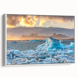 Framed canvas wall art featuring a stunning glacier landscape design, showcasing vibrant blue and white tones, perfect for modern home décor. The artwork is displayed from a side view, emphasizing its sleek frame and captivating natural scenery, ideal for creating a serene atmosphere.