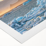 Stunning rolled canvas art showcasing a vibrant glacier landscape design, featuring icy blues and whites, elegantly packaged in protective cardboard tubing.
