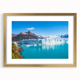 Framed wall art featuring a stunning glacier landscape design in gold frame and mat, showcasing serene icy blues and whites, perfect for home decor.