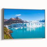 Framed canvas wall art showcasing a stunning glacier landscape design, featuring cool blue and white tones, elegantly displayed from a side view with a silver frame. Perfect for adding a serene, nature-inspired touch to any room.