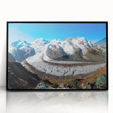 Framed wall art depicting a stunning glacier landscape with vibrant blues and whites, enclosed in a sleek black frame, perfect for modern home decor.